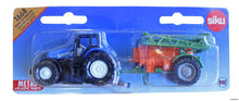 New Holland traktor med fältspruta